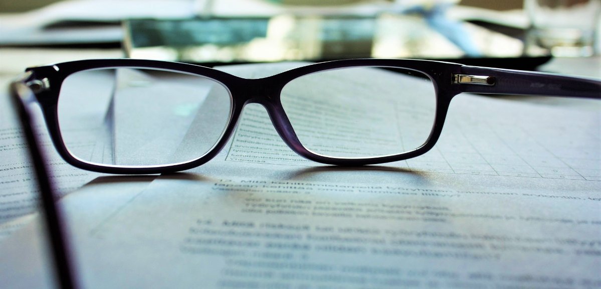 image of spectacles sitting on papers